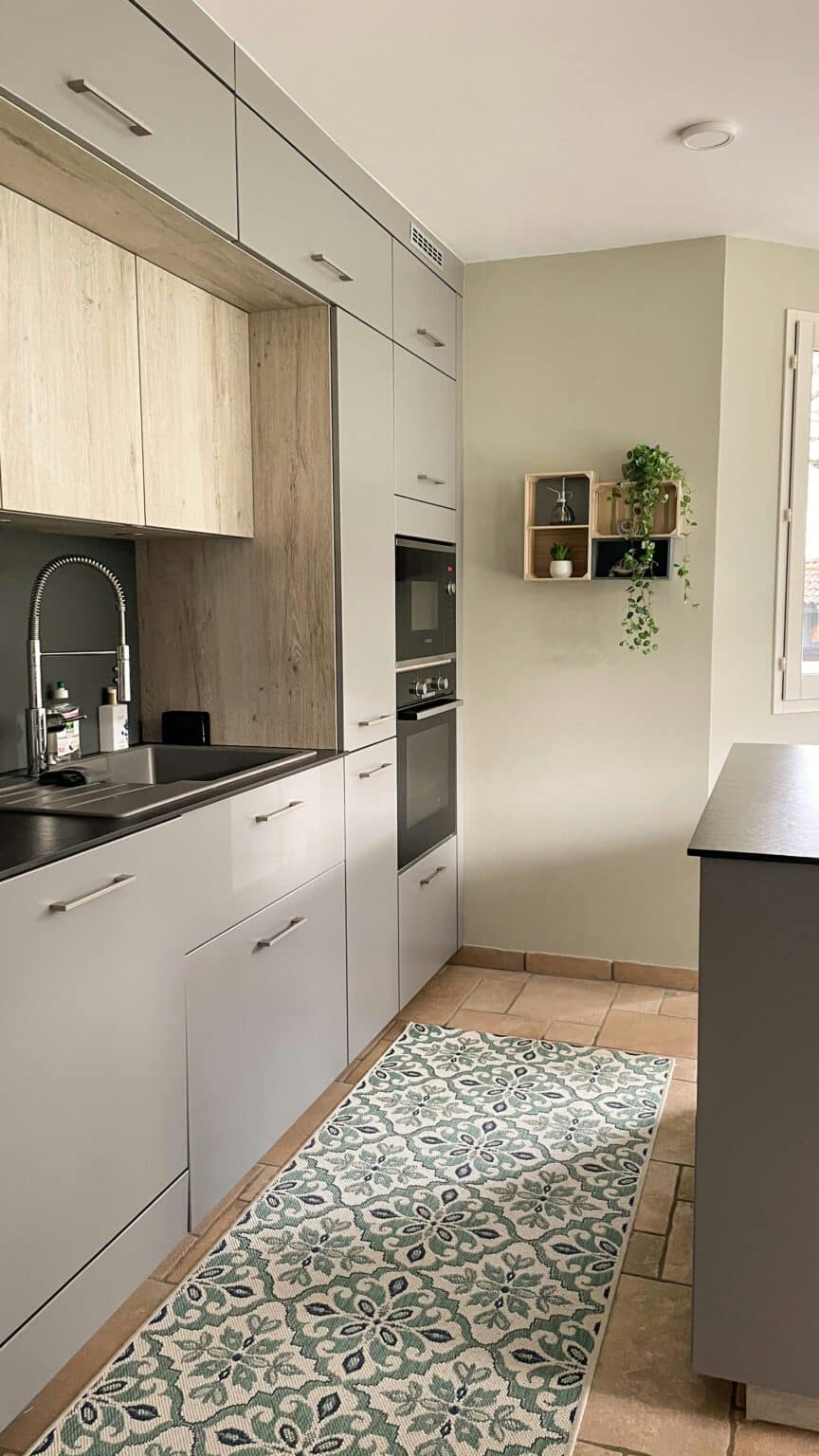 Small kitchen with a rug on the floor