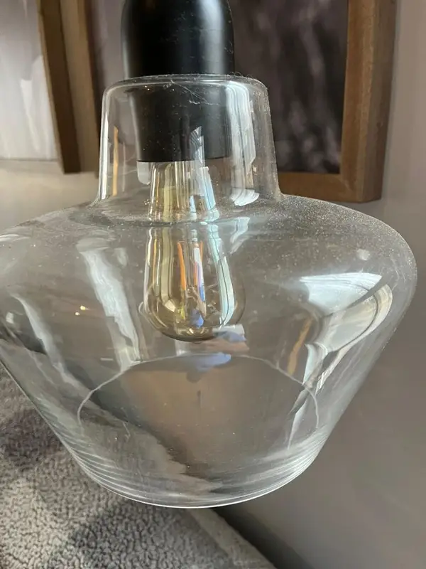 Glass pendant light with dust and spots before deep cleaning