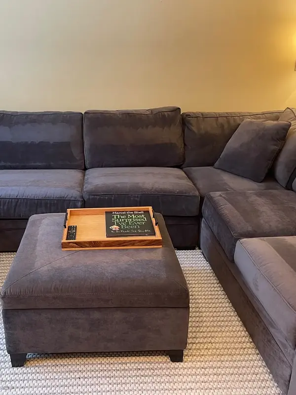 The same sectional with cushions straightened and the throw folded, Simsbury, CT