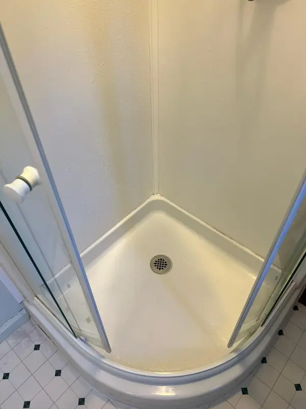 The same shower pan scrubbed clean and white, Glastonbury, CT