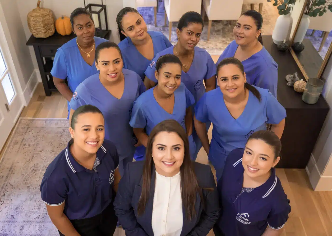 The Family Cleaners team gathered around CEO Caroline Compiani